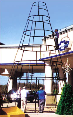 Metal tree case that helps support a giant christmas tree going in the middle of a shopping center