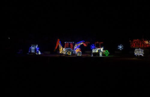 Construction vehicles covered in led christmas lights