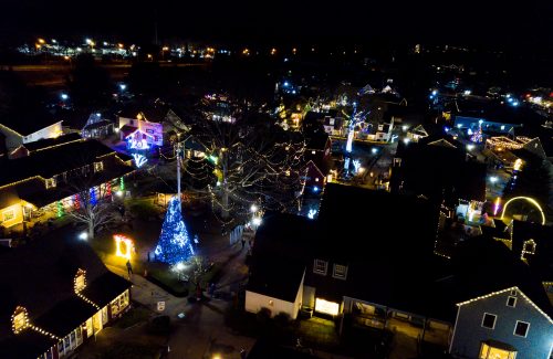 Aerial view of town with christmas lights