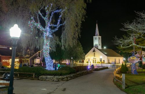 Lighted tree outside a church