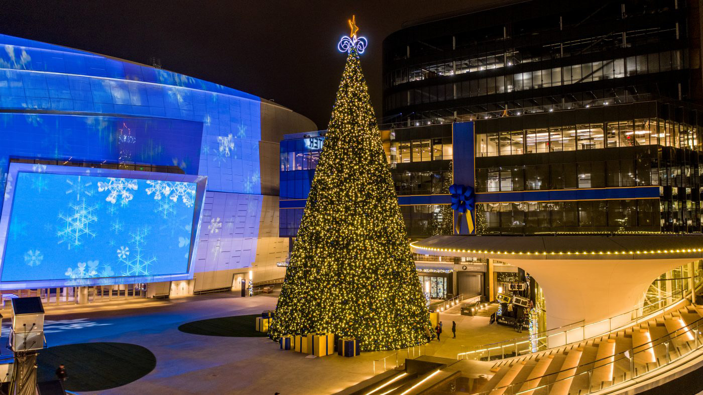 Large beautiful Christmas tree in front of an indoor sports arean